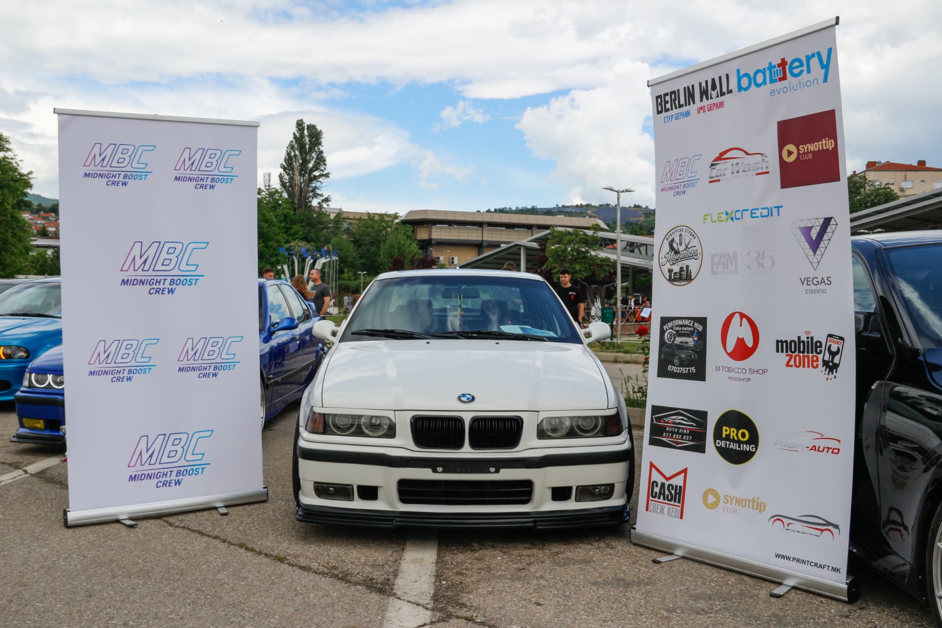 White BMW E36 between MBC and sponsor banners