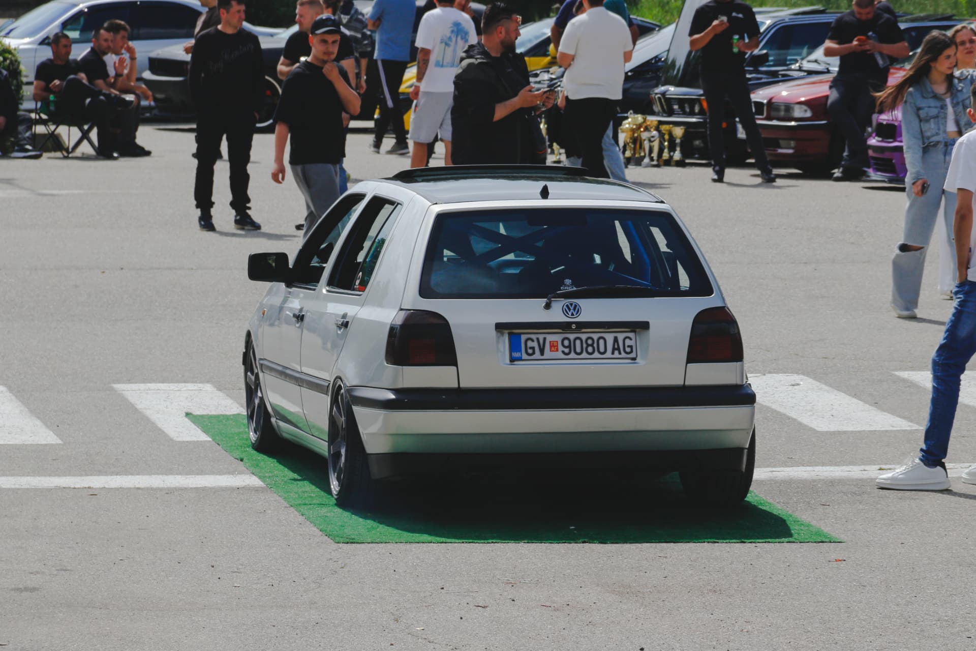 Lowered silver VW Golf on display