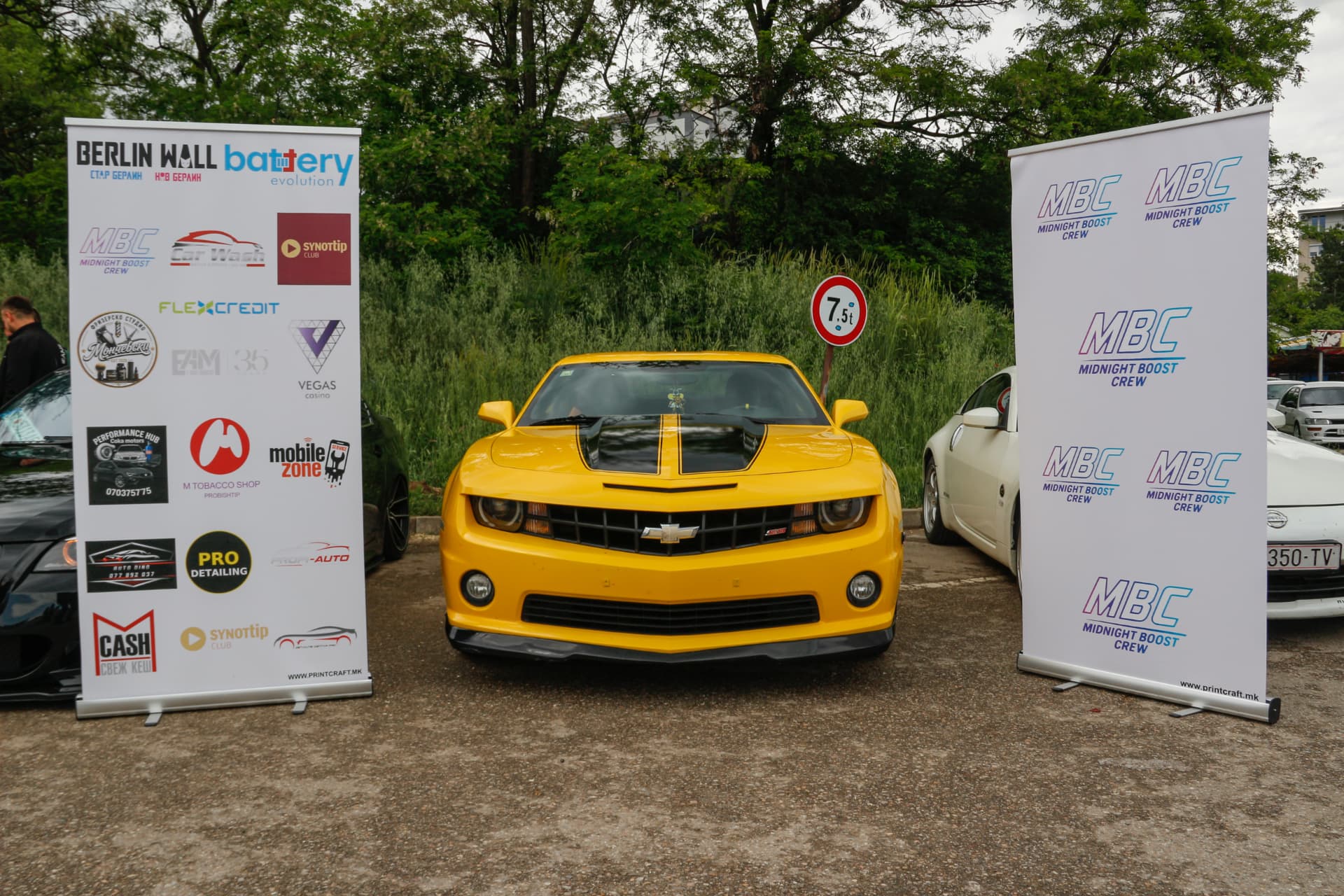 Yellow Chevrolet Camaro between MBC and sponsor banners