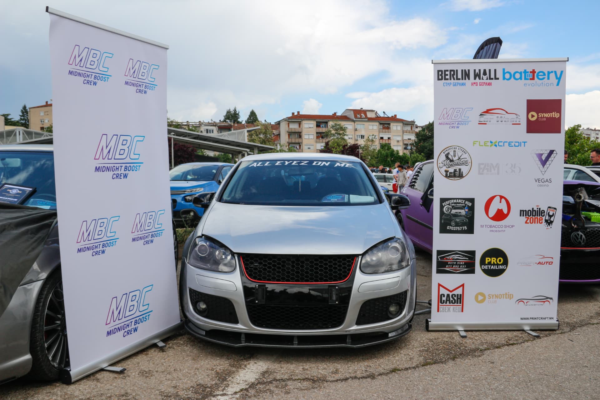 Silver VW Golf GTI Edition 30 between MBC banners