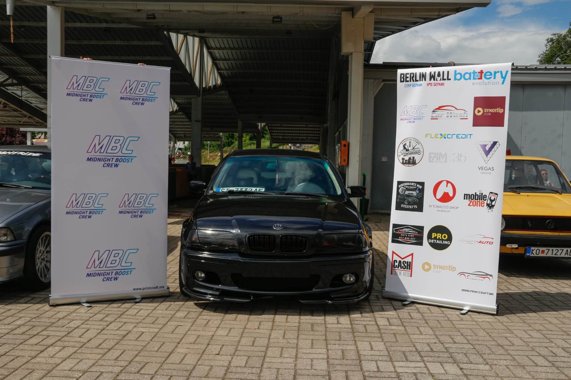 Black BMW E46 between MBC banners